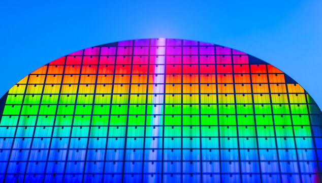 wafer silicon monocrystalline  with microchips after photolithography etching manufacturing reflecting different colors used in fabrication of electronic integrated circuits.