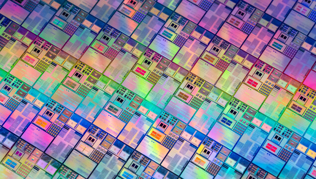 wafer silicon monocrystalline  with microchips after photolithography etching manufacturing reflecting different colors used in fabrication of electronic integrated circuits.
