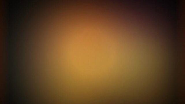 Vibrant glowing amber gradient abstract background with dark vignette edges and soft light center, perfect for website backgrounds, digital design and video overlays