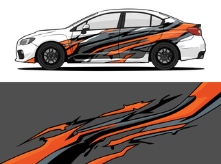 Fototapeta premium White sports sedan with dynamic orange and black wrap design