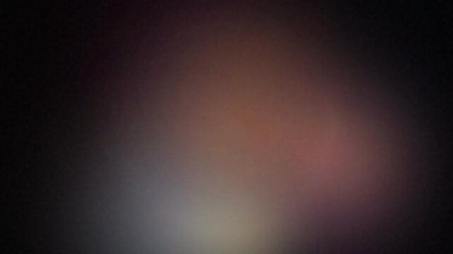 Abstract ethereal motion background with soft glowing purple and orange light gradients, suitable for creative transitions, visual effects and web design
