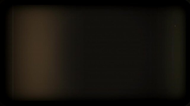 Vintage film grain overlay with subtle light leak and scratches on dark background, perfect for video editing, retro aesthetics and cinema