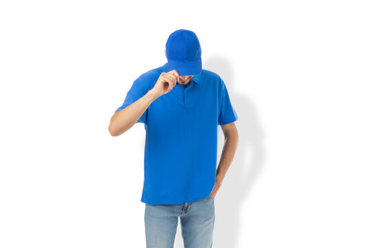 Man poses in blue shirt and cap ready for design, PNG