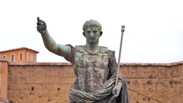 Ancient Roman emperor Augustus bronze statue pointing forward in slow motion footage.