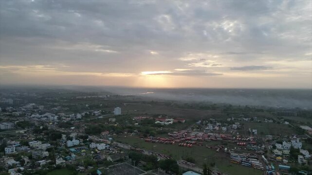 Sunburst Through the Clouds: Hazy Morning Cityscape.