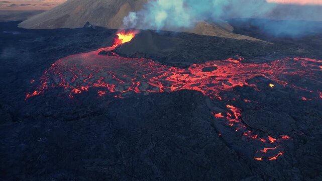 Aerial view of the Fagradalsfjall volcanic eruption on the Reykjanes Peninsula in Iceland showing active lava fountain flowing lava smoke and newly formed lava field