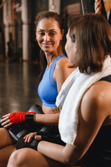 Fototapeta premium Two athletes talking together during training in a boxing gym