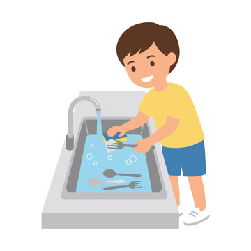 Young Boy Helping Out By Washing Dirty Silverware In A Kitchen Sink With A Sponge And Water