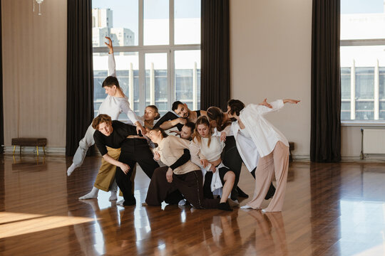 Group of dancers dancing together in a contemporary dance studio