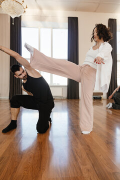 Two dancers practicing dance in a contemporary dance studio