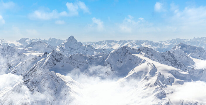 Panorama of winter mountains with blue sky in Caucasus region,Elbrus mountain, Russia