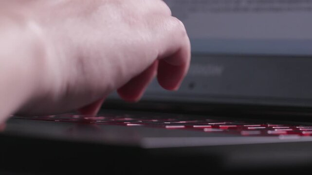 Close‑up of human hands typing on mechanical keyboard, office workspace background, computer work footage