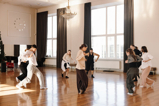Group of dancers practicing dance in a contemporary dance studio