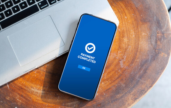 Mobile Smartphone Displaying Payment Completed Icon
