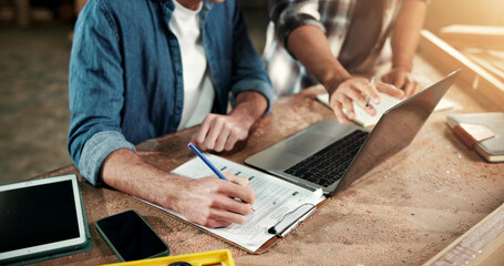 Obraz na płótnie Canvas Hands, carpenter and laptop at factory with clipboard, research and pricing timber for production. People, checklist and pc at workshop for carpentry, quotation and team for manufacturing furniture