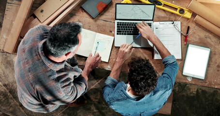 Carpenter, paperwork and above of men on laptop for planning, production schedule and report....