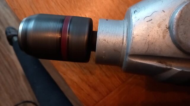 Drill chuck emits metallic whine while reaching maximum RPM in a close-up view
