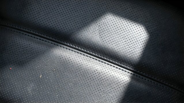 Close-Up of Textured Black Leather with Subtle Light Reflection