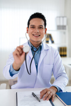 Close Up of a Doctor Holding a Stethoscope in a Medical Setting.