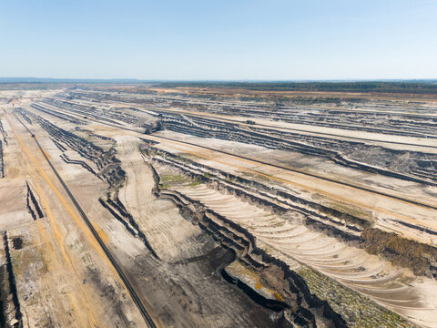 Aerial view of Hambach open pit mine showing extensive terraced excavation and industrial lignite mining operations in Elsdorf, North Rhine-Westphalia, Germany.