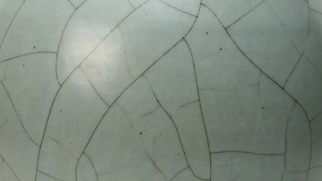 Intricate Surface Pattern with Cracked Texture in Soft Green Hue
