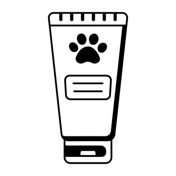 A pink tube of toothpaste marked with a paw symbol.