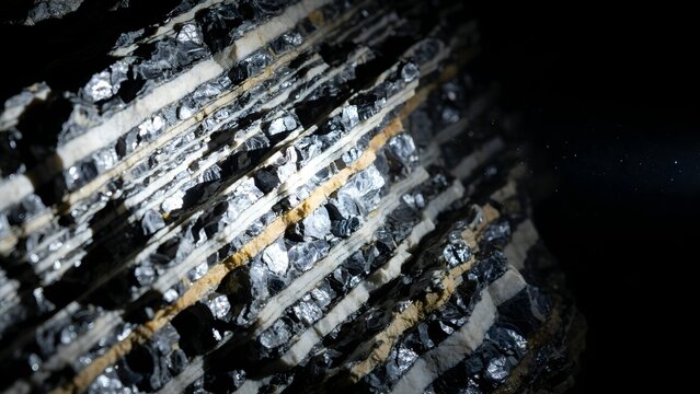 Detailed Close-Up of Striated Rock Surface with Mineral Textures