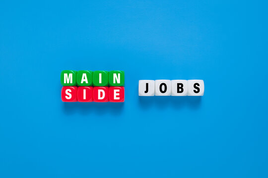 main and side jobs words symbol on cubes. isolated on blue background. main and side jobs management concept