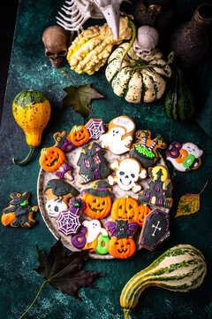 Halloween cookies in shape of bat ghost jack-o-lantern and skull