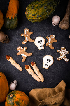 Halloween scary gingerbread cookies in shape of skull zombie and mummy