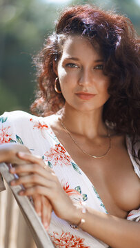 Close-Up Beauty Portrait of Boho Woman in Floral Dress, Sunny Terrace