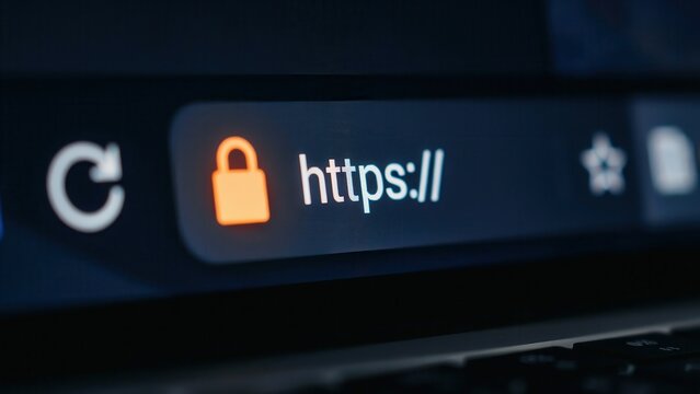 A secure https web address with a padlock icon displayed on a laptop browser. Cybersecurity concept for safe internet browsing and data protection.