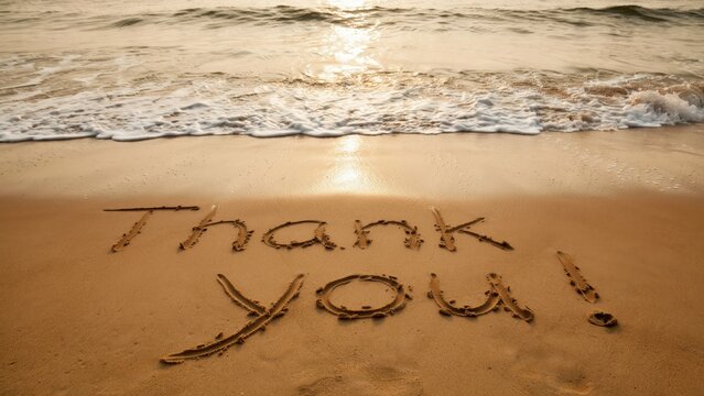 Thank you written in the wet sand on a tropical beach at sunset. Perfect concept for customer appreciation, gratitude messages, and vacation marketing.