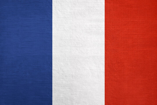 French national flag painted on wooden surface featuring blue white and red vertical stripes with subtle horizontal wood grain texture patriotic European country background design France