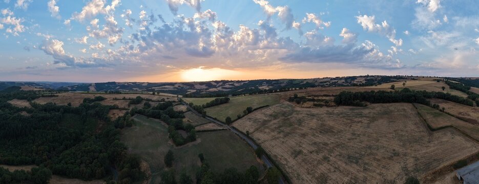 Panoramic Sunset Over Rolling Farmland and Rural Countryside