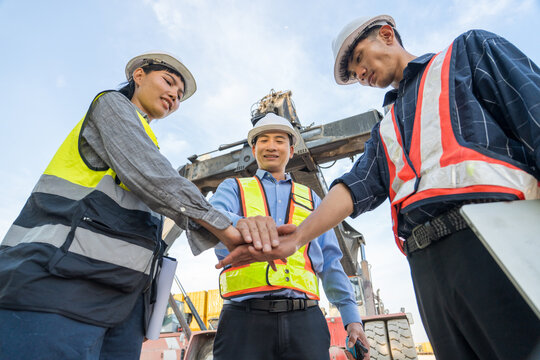 Diverse construction team collaborating at site for effective project management