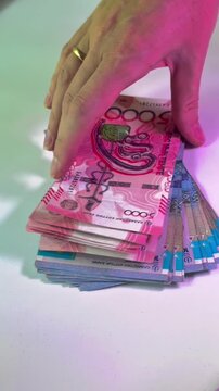 euro banknotes in a piggy bank