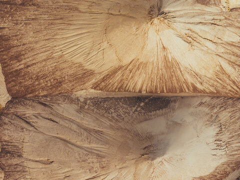 Aerial view of sand piles creating abstract textures and shapes, Poland.