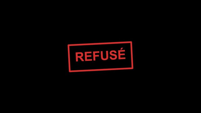 Red rubber stamp with the word refuse written in french inside a rectangle frame on a dark black background