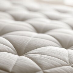 Fototapeta premium Close-up of a soft, quilted mattress surface with a luxurious, textured feel for comfortable sleep