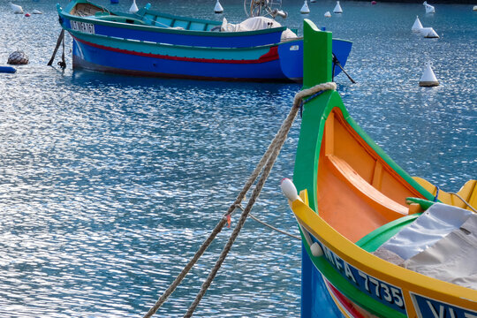 Colorful luzzu boat floating in the harbor of sliema, malta