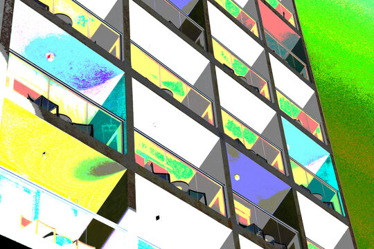 Colorful modern apartment building exterior with balconies and blue sky