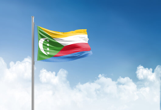 Comoros flag waving in beautiful sky.