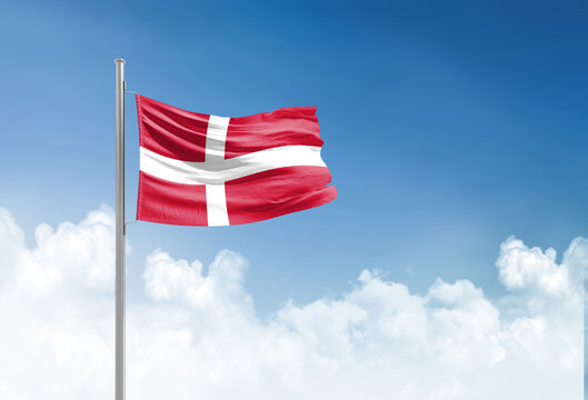 Denmark flag waving in beautiful sky.