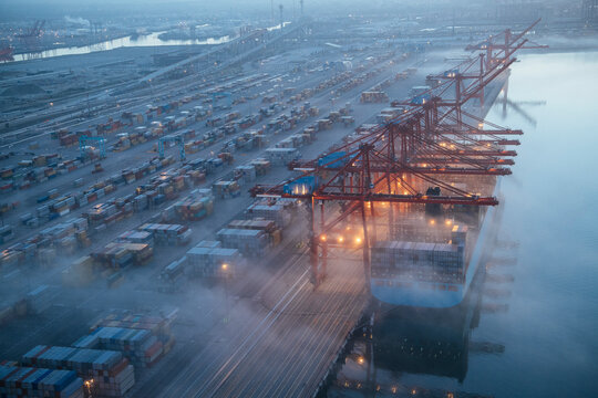 Cargo ship being loaded with containers at a port in Long Beach, CA, USA