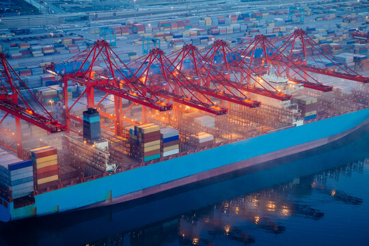 A container ship is loaded with cargo containers