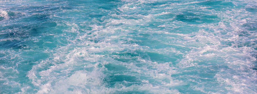 The wake on the water behind the ferry