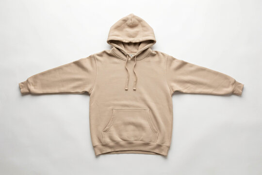 Beige pullover hoodie mockup laid flat on white background, casual streetwear sweatshirt with hood and drawstrings for apparel branding