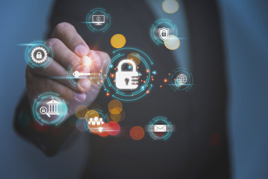 A professional businessman uses a digital pen to touch a glowing cybersecurity interface with a padlock icon highlights advanced data protection and privacy options.