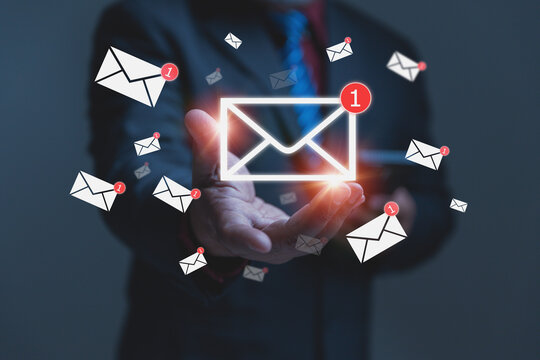 A professional businessman holds out his hand to display a large, glowing email icon featuring several red circular alert icons emphasizing unread mail and direct customer contact.